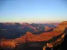 (view east-northeast, from Mather Point-(Yavapai Point))O'Neill Butte, on ridgeline north, from Newton Butte. Pattie Butte sits on an upper platform of Redwall Limestone, overlain by a 2nd-platform of Surprise Canyon Formation. (partly eroded)