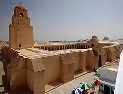 Stone building with tower and courtyard