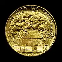 Gold dollar with a house shaded by trees