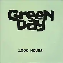 Two lines of text, "Green Day" and "1,000 Hours", in black ink against a light green background