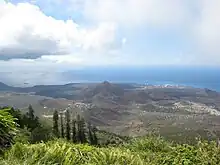 Two Boats Village is visible in the centre of the image, taken from atop Green Mountain