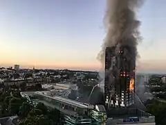 Photo of the Greenfell Tower apartment complex engulfed in fire and smoke