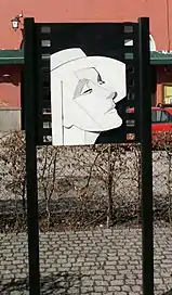 Drawing of Garbo in a city street