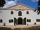 Cloete Cellar building, the original wine cellar at the estate. The pediment gable is by the sculptor Anton Anreith.