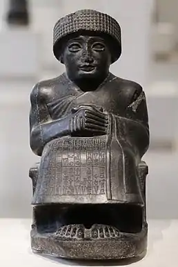 Statue of Gudea I, dedicated to the god Ningishzida; 2120 BC (the Neo-Sumerian period); height: 46 cm (20 in), width: 33 cm (10 in), depth: 22.5 cm (8.9 in); Louvre