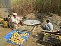 Jaggery (gur) making at small scale near sugarcane farm in Pakistan