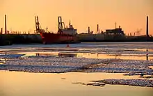 Ships in snowy Hamburg, Germany harbour