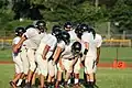 Hamilton West Hornets huddle, September 2013 in a football game vs the North Brunswick Raiders