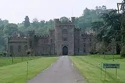 Gray stone castle with a large central tower