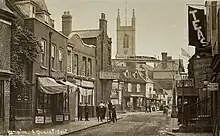 Hampton Thames Street c1911, showing the Red Lion hotel, the frontage to Constable's Boatyard and St Mary's Church. Note also the unsurfaced road.