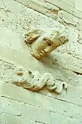 Protruded head on a wall