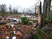 EF4 damage: Brick home reduced to piles of rubble. Above-ground structures are almost completely vulnerable to EF4 tornadoes, which level well-built structures, toss heavy vehicles through the air, and uproot trees, turning them into flying missiles. Around 1.1% of annual tornadoes in the U.S. are rated EF4.