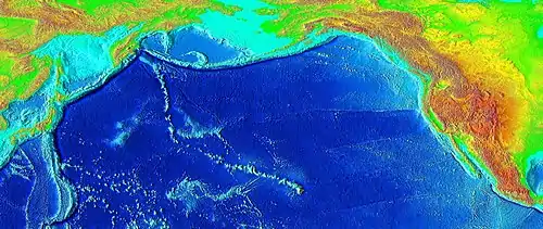 Raised-relief map of the Pacific basin, showing seamounts and islands trailing the Hawai’i hotspot in a long line terminating near the Kamchatka Peninsula in Russia