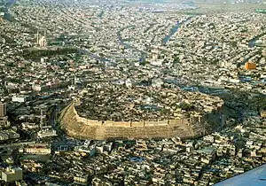 Aerial view of the Citadel of Erbil, surrounded by the modern city