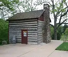 Looking South-West. The log schoolhouse was originally from Antioch Farm in Haymarket, Virginia.  Moved to Sully in 1963