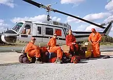 A contract Bell 205A-1 with its MNR helitack firefighting crew on standby at Sioux Lookout, Ontario, 1995