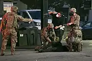 Georgia National Guard medics treat a protester injured by tear gas on June 2, 2020