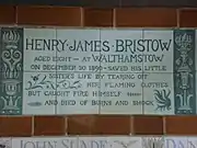 A tablet formed of six standard sized tiles, bordered by green flowers in the style of the Arts and Crafts movement