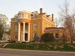 Old three-story mansion with columns and round observatory