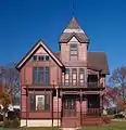 The Herman C. Timm House in New Holstein, Wisconsin, has stickwork painted in a darker brown for contrast.