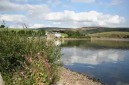 A lake with hills beyond