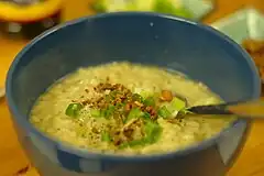 Arroz caldo, savoury lugaw with chicken, ginger, toasted garlic, scallions, and safflower