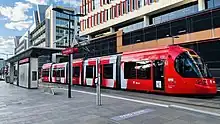 A light-rail vehicle of the Newcastle Light Rail on Honeysuckle, an urban development in Newcastle, New South Wales