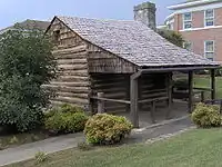 Log cabin in downtown Monticello, Kentucky, built in the early 19th century by "Raccoon" John Smith (1784–1868). The cabin was originally located in Horse Hollow on the Little South Fork River.