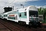 Modernized double-decker train of S1 with a 1992 control car in 1995 at Leipzig-Sellerhausen railway stop