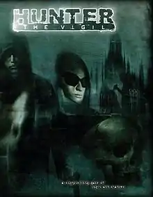 A green-tinted picture depicting hooded figures and a skull