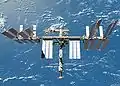 The newly upgraded International Space Station seen from the shuttle after undocking.