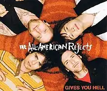 The band members lying down, the band name in the center, with the song title in the bottom-right.