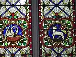 Pelican vulning and Lamb of God with flag with Triumphal cross, both symbols of the Resurrection (stained glass, Ireland, 19th century)