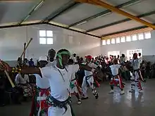 people dancing in a hall