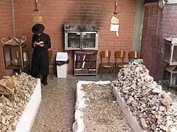 The graves of Avraham Mordechai Alter (right) and his son, Pinchas Menachem Alter (left) in an ohel adjacent to the Sfas Emes Yeshiva in downtown Jerusalem