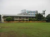 Del Pilar Academy (Blue Building) behind Imus Pilot Elementary School