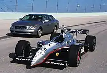 Infiniti Indy car next to third-generation Infiniti Q45