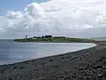 Beach with lighthouse visible