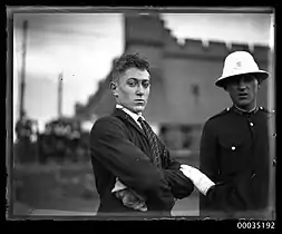 Injured passenger and policeman at Fort Macquarie
