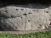 Megalithic art on the back kerbstone.