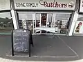 Irish butcher implementing ad hoc social distancing measures.