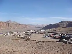 Trucks waiting to cross into China in the village of Erkeshtam