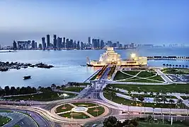 The museum with the city skyline in the background