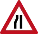 Road narrows from left ahead