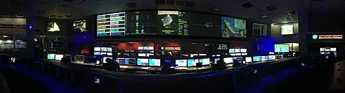 panaorama of the SFOF from the center of the room between the  Cassini and Curiosity mission control consoles