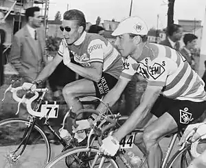 Cyclists talking and riding together.