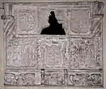 16th century mural monument believed to be James Coffin, surrounded by escutcheons of the Coffin arms