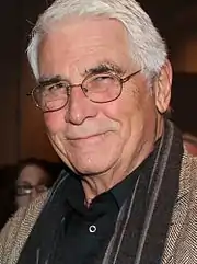 Actor James Brolin staring towards a camera taking his picture in 2013.