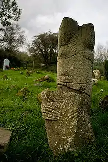 Photo of the broken bases of the statues with hands engraved