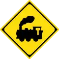 Traffic sign in Japan warning that the road crosses a railway